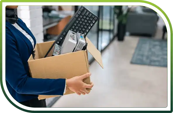 Person moving a box containing various electronics