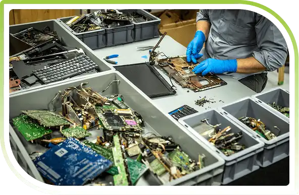 Plastic bins containing computer circuit boards.