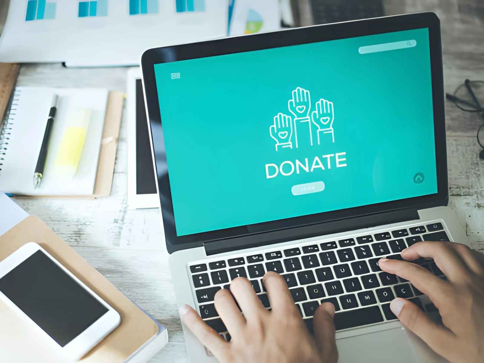 Laptop showing a donation page, representing donated IT equipment making a community impact