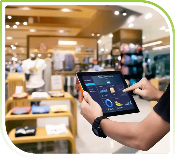 Retail staff using a tablet to monitor store inventory and sales analytics