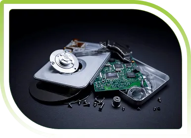 Disassembled hard drive with exposed components, representing secure IT asset liquidation, data destruction, and ITAD services.