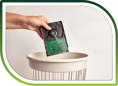Recycling bins filled with electronic components in a facility, representing secure IT asset recycling and environmentally responsible ITAD services.