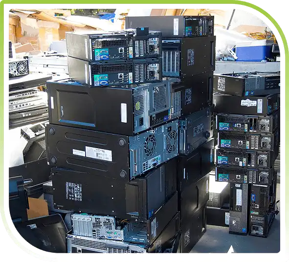 A large stack of discarded black computer towers.