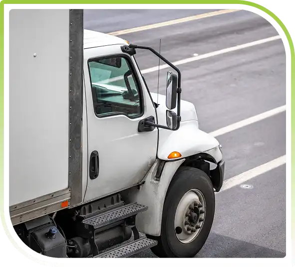 Delivery truck on a roadway, representing reverse logistics pickup, returns management, and transportation services.